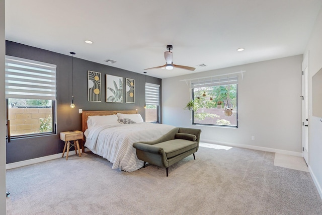 carpeted bedroom featuring ceiling fan