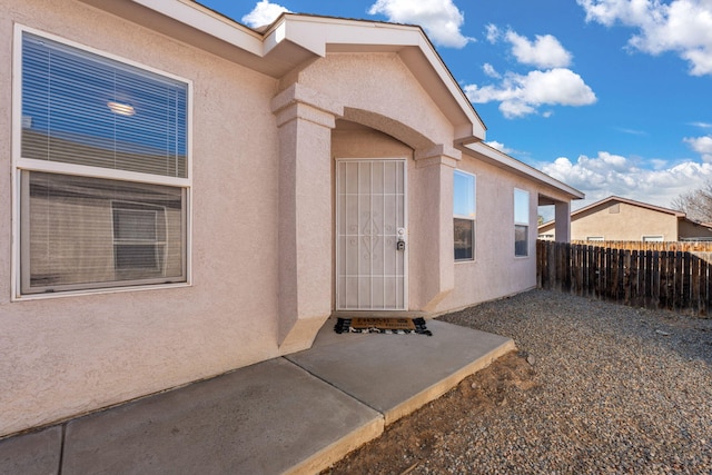 property entrance with a patio