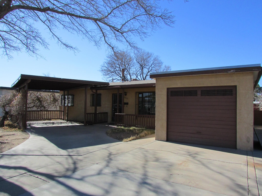 ranch-style house featuring a garage