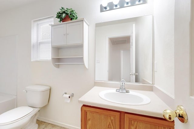 bathroom with toilet and vanity