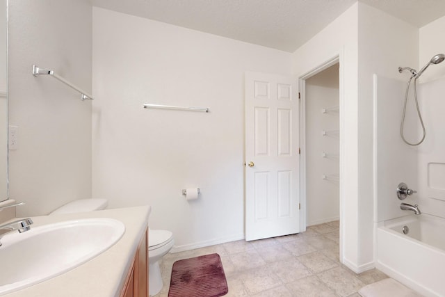 full bathroom featuring toilet, vanity, and shower / washtub combination