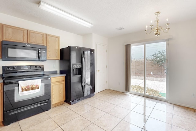 kitchen with black appliances, a textured ceiling, light tile patterned floors, and an inviting chandelier