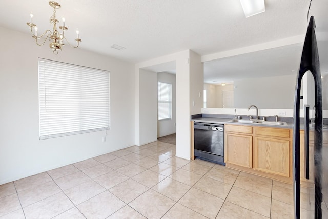 kitchen featuring a textured ceiling, black appliances, light brown cabinetry, sink, and light tile patterned floors