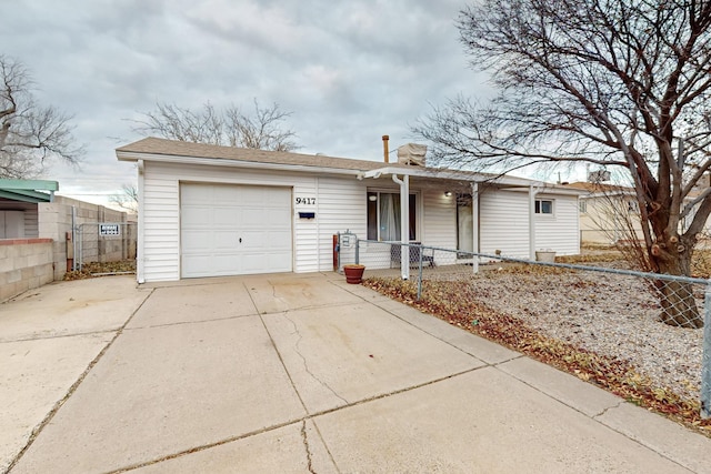 ranch-style home featuring a garage