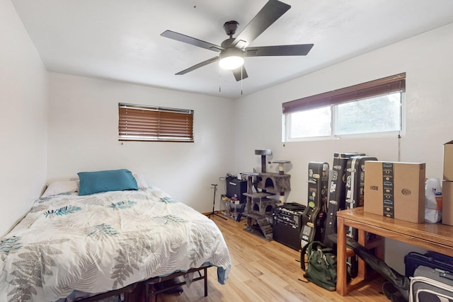 bedroom with ceiling fan and light hardwood / wood-style floors