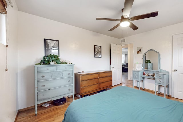 bedroom featuring ceiling fan and hardwood / wood-style flooring