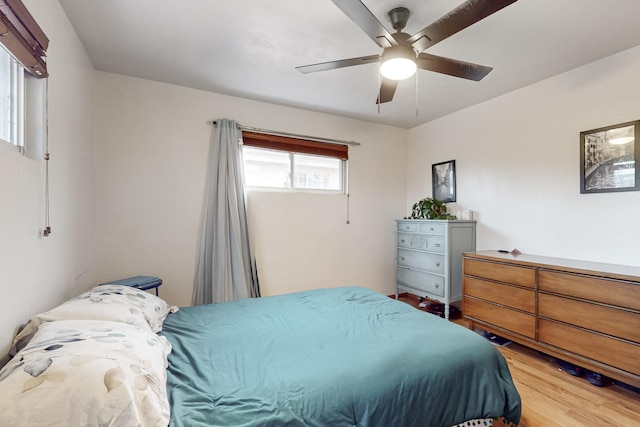 bedroom featuring ceiling fan and hardwood / wood-style floors