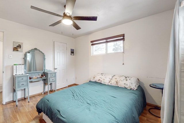 bedroom featuring ceiling fan and light hardwood / wood-style flooring