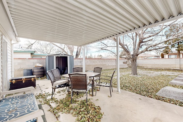 view of patio with a shed