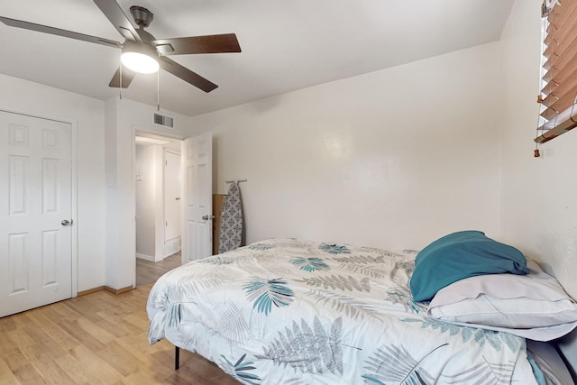 bedroom with ceiling fan and light wood-type flooring