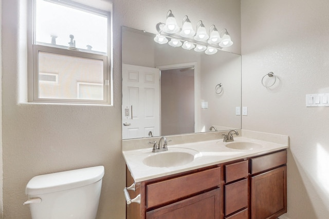 bathroom with vanity and toilet