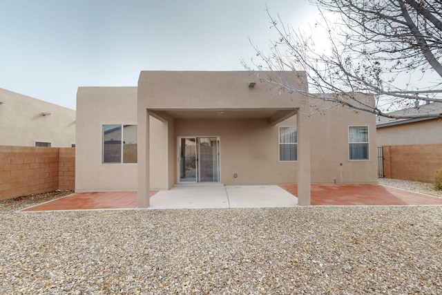 rear view of property featuring a patio