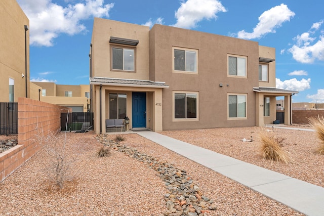 pueblo-style house with central AC unit