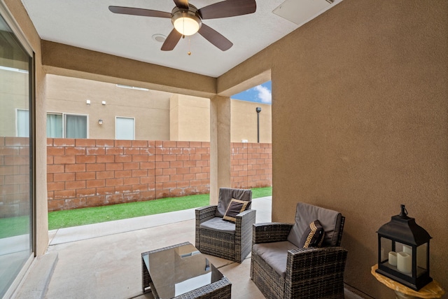 view of patio / terrace featuring ceiling fan and an outdoor living space