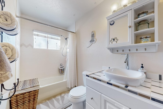 full bathroom featuring shower / tub combo with curtain, vanity, and toilet