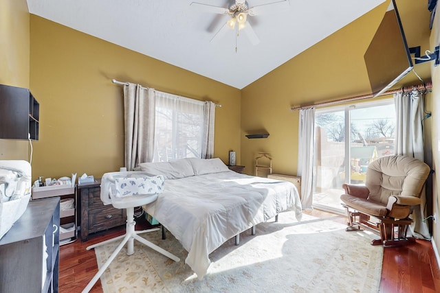 bedroom with lofted ceiling, ceiling fan, and dark wood-type flooring