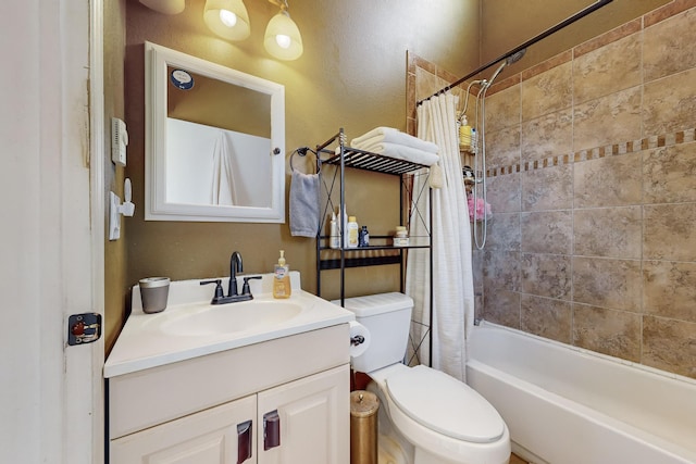 full bathroom with shower / tub combo, vanity, and toilet