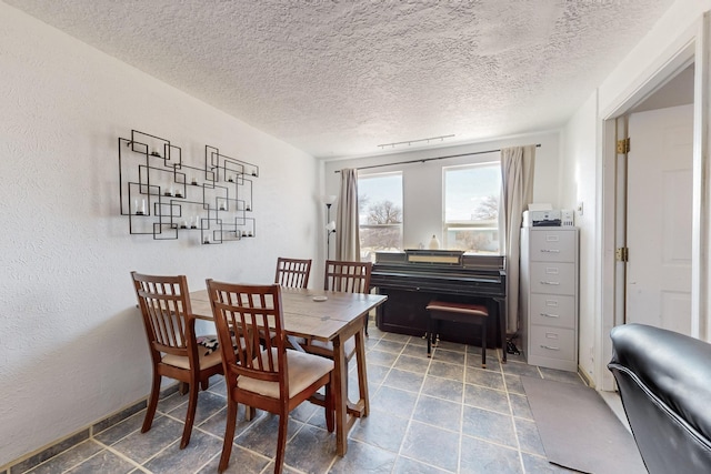 dining area with a textured ceiling