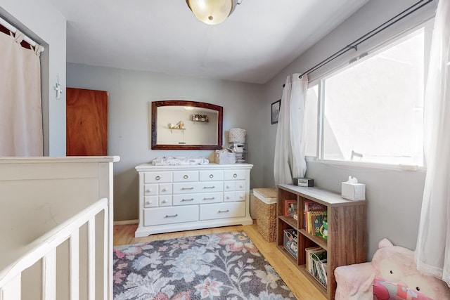 bedroom with light wood-type flooring