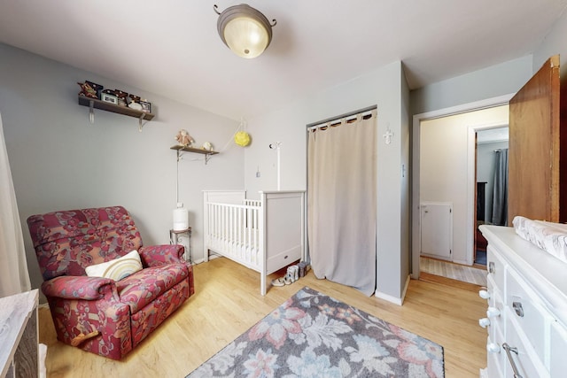 bedroom with light hardwood / wood-style flooring