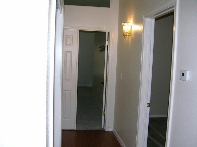 corridor featuring dark hardwood / wood-style flooring