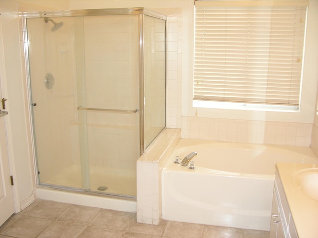 bathroom with vanity and plus walk in shower