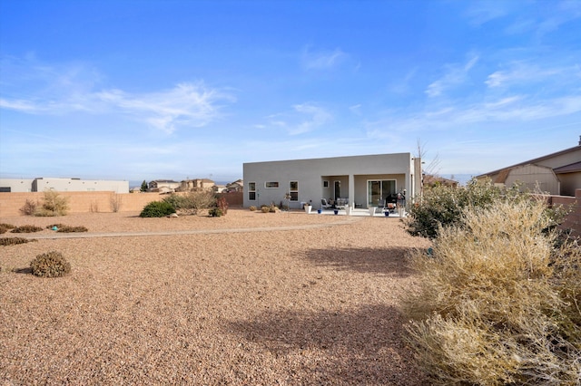 rear view of property featuring a patio