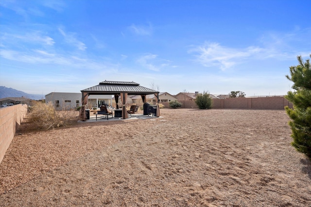 view of yard featuring a patio area and a gazebo