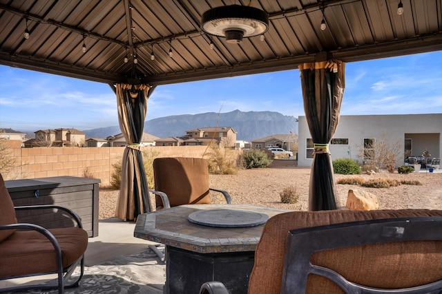 view of patio / terrace with a gazebo and a mountain view