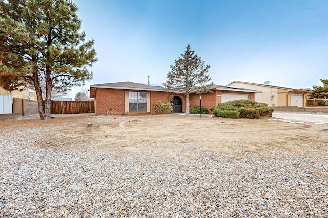 ranch-style home featuring a garage