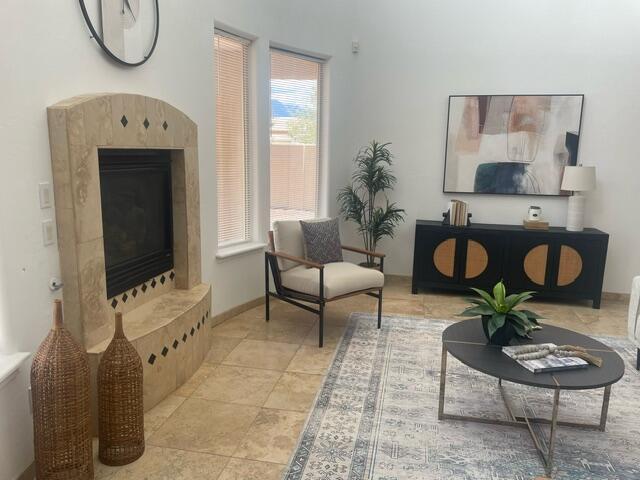 living area with a high end fireplace