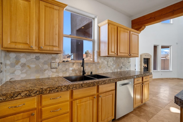 kitchen with dishwasher, beamed ceiling, light tile patterned floors, sink, and backsplash