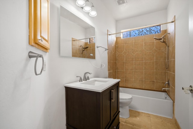 bathroom with toilet, vanity,  shower combination, and tile patterned flooring