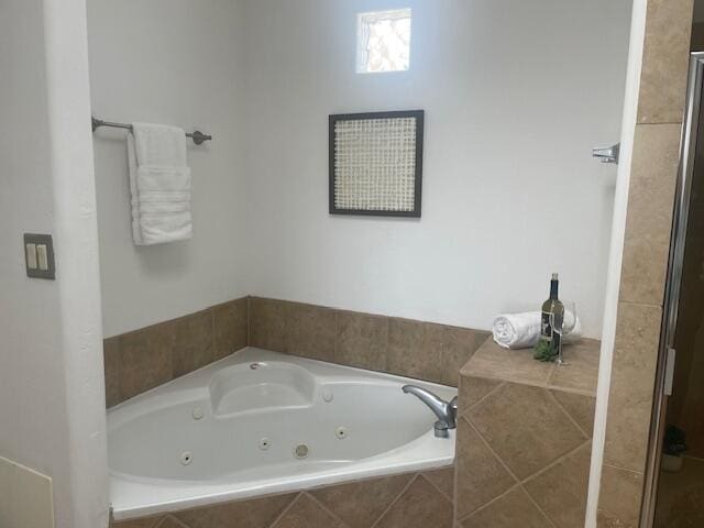 full bath with a tub with jets and a shower stall