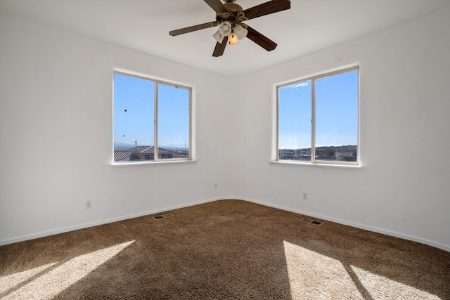 unfurnished room with carpet floors and ceiling fan