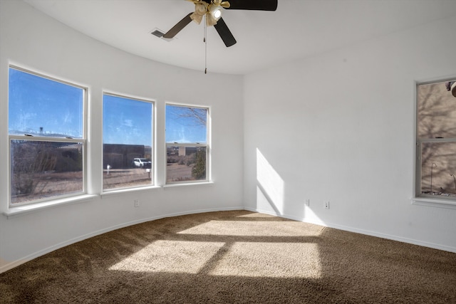 unfurnished room featuring ceiling fan and carpet floors