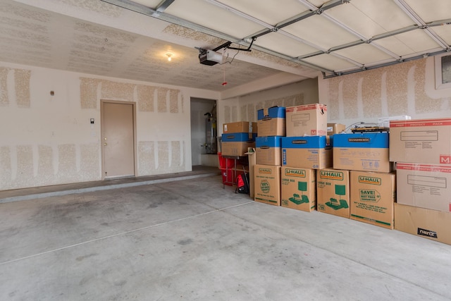 garage featuring secured water heater and a garage door opener