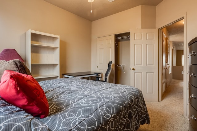 carpeted bedroom featuring a textured ceiling and a closet