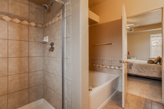 bathroom with tile patterned floors and shower with separate bathtub