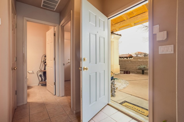 corridor with light tile patterned flooring