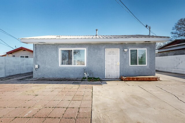 rear view of property with a patio