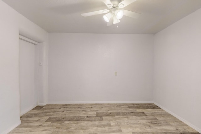 spare room featuring ceiling fan and light hardwood / wood-style floors