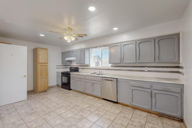 kitchen featuring sink, black gas range, dishwasher, and gray cabinetry