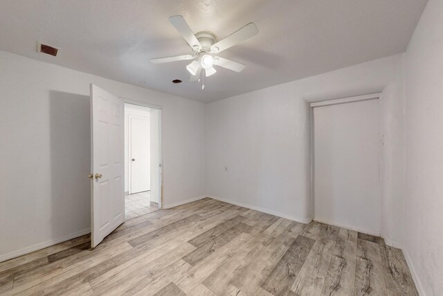 kitchen with stainless steel dishwasher, black gas range oven, gray cabinetry, ceiling fan, and sink