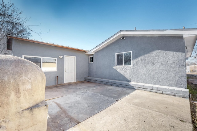 back of house with a patio area