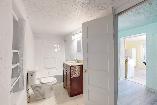 full bathroom with vanity, tile patterned floors, toilet, a textured ceiling, and shower / bath combination