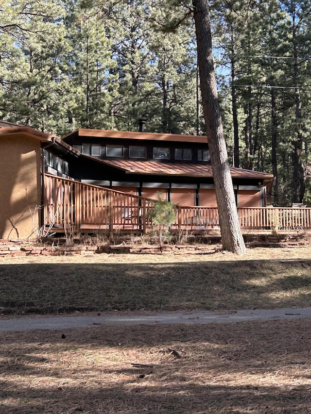 view of yard with a wooden deck