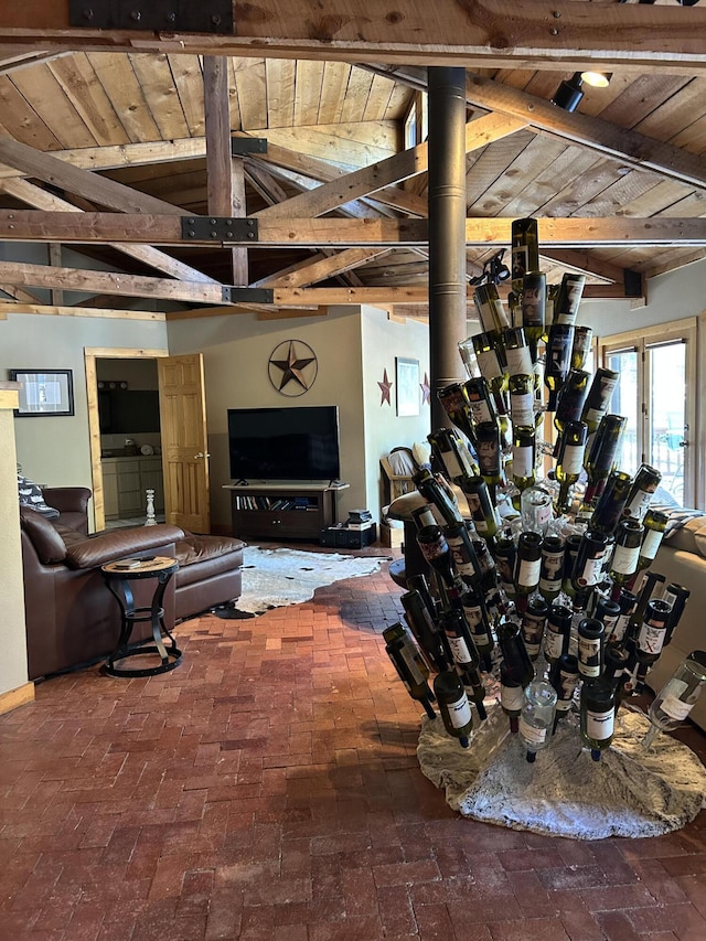 living room with lofted ceiling with beams and wood ceiling