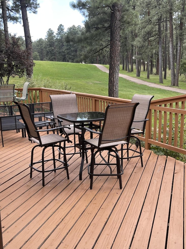 wooden deck with a yard