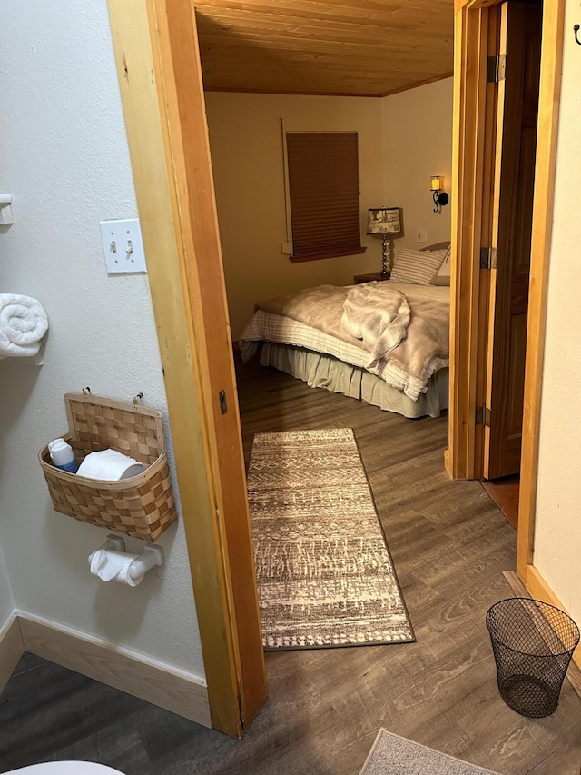 bedroom with wooden ceiling and hardwood / wood-style floors